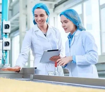 Women in manufacturing working on EHS